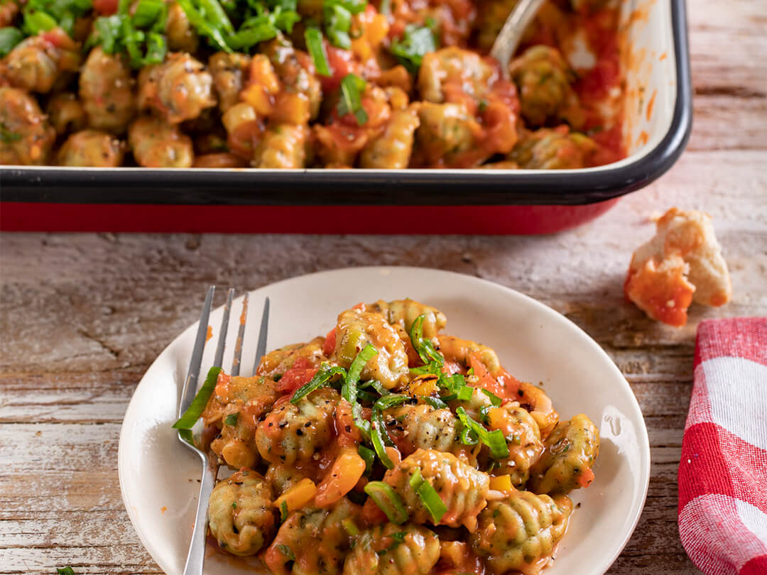 Ñoquis de espinaca con salsa de tomates cubeteados