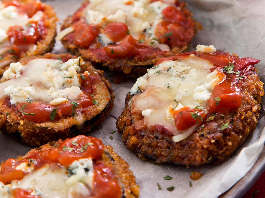 Milanesas de berenjena a la napolitana con salsa portuguesa